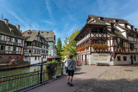 Tourists in the Petite France, a famous Little Venice district in Strasbourg, France