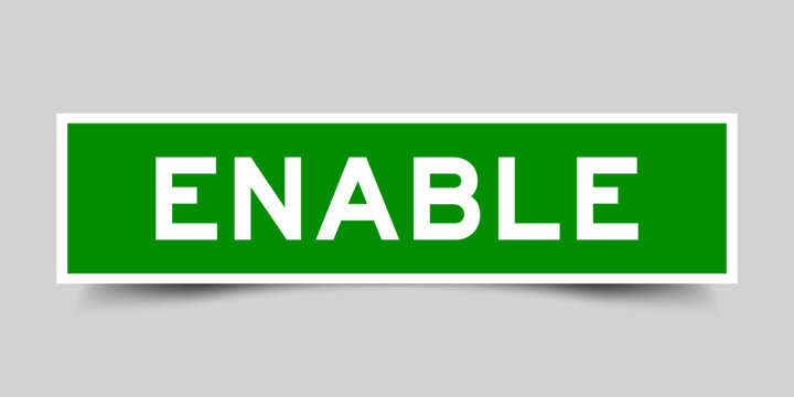 Green color square label sticker with word enable that inserted in gray background