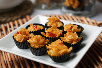 Honey Cornflakes (Cornflakes Madu) a popular cookies in Malaysia during celebration of Eid Mubarak (Hari Raya) on selective focus