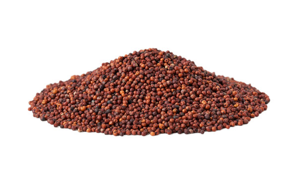 pile of red finger millet or ragi raagi nachni isolated on white background