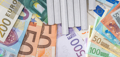 Euros paper Money EU with cigarettes. Concept of high prices of tabacoo