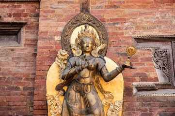 Beautiful ancient bronze statue decorated in Patan Durbar square situated at the centre of the city of Lalitpur in Nepal.