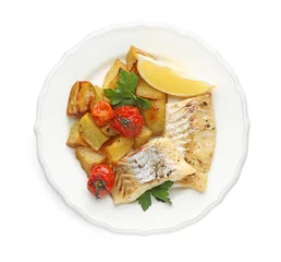 Fotobehang Tasty cod cooked with vegetables isolated on white, top view © New Africa