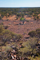 The name of God written in huge letters on a rocky plain in the Western Australian outback. Christian religious concept in a very remote place in the desert. Land art in Karalundi. 
