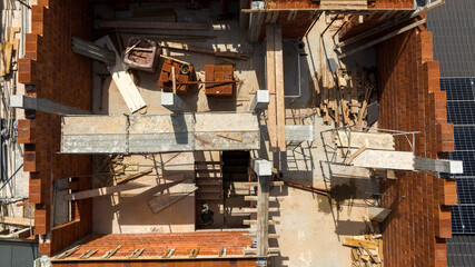 Aerial zenithal view of a house under construction. Construction site.
