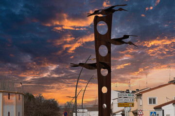 alfaro,la rioja,spain- 20,february 2024:Artistic silhouettes of several storks at the entrance to...