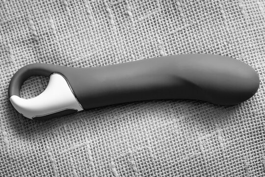 Big dildo, intimate toy for women.
Vibrator for pleasure.
Black and white photo
