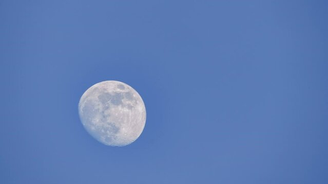 moon in the sky with clouds timelapse