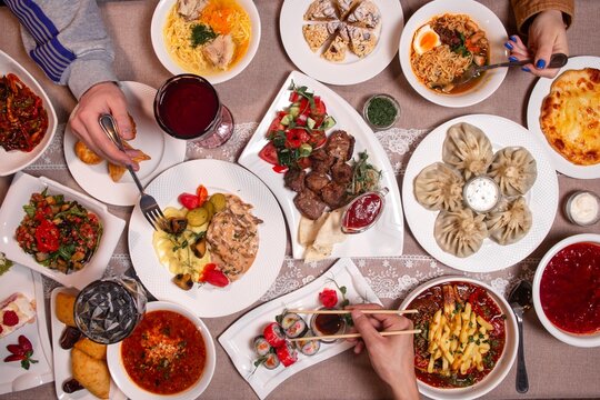 A diverse buffet featuring traditional dishes from around the world, showcasing the culinary heritage of various cultures