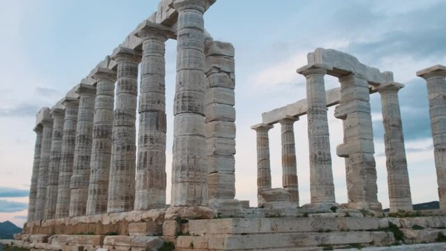 Temple of Poseidon on Cape Sounion at sunset, Attica, Greece. Ancient Greek architecture. Ruins of ancient temple of Greek god of the sea. Popular travel and touristic destination