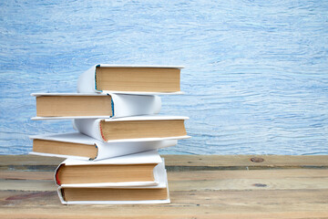 open book, books on the blue background. Back to school. Education. Copy space for text.