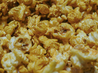Delicious sweet popcorn, close-up shot for dessert food background. 