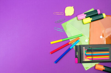 Back to school. Stationery on a Purple table. Office desk with copy space. Flat lay.