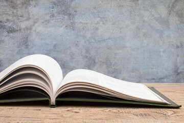 open book, books on the gray concrete background. Back to school. Education. Copy space for text.