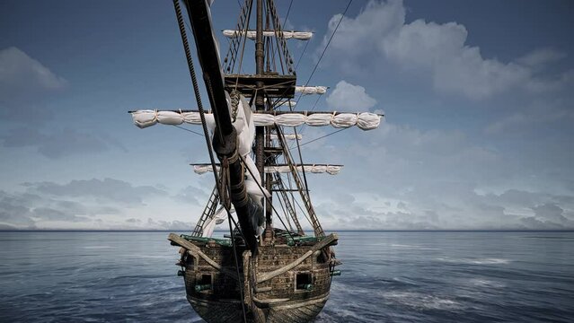 An aerial view over the top deck of an old abandoned galleon ship at sea.
