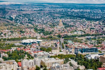 View on the capital city of Tbilisi and the Sameba cathedral from Mtatsminda park (Georgia) 