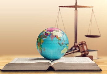 world globe,  wooden gavel for law international concept