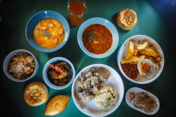 Top view of delicious and healthy food on the green table.
