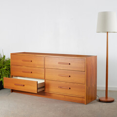 1960s six-drawer dresser. Vintage teak furniture. Interior product photograph.