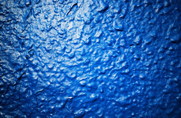 Blue bumpy painted wall texture background