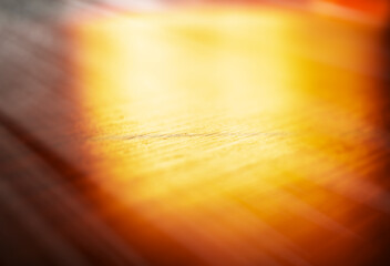 Dramatically illuminated wooden table surface background