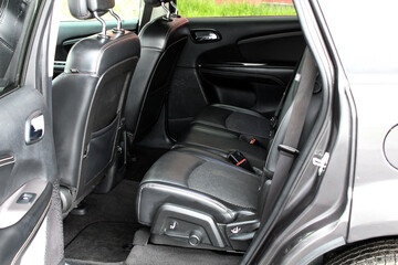 Sport SUV rear seats. Sport SUV interior. Premium car Back passenger seats with armrest. Sport SUV...