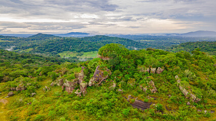 Aerial view of lush, green landscape with unique rock formations at Ciudad de Piedra, San Jose del...