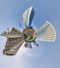 abstract swirling tiny planet spherical panorama of multi-storey buildings of skyscrapers of a residential complex in the form of a butterfly in blue sky - 791820302