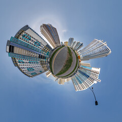abstract swirling tiny planet spherical panorama of multi-storey buildings of skyscrapers of a residential complex in the form of a butterfly in blue sky - 791820363