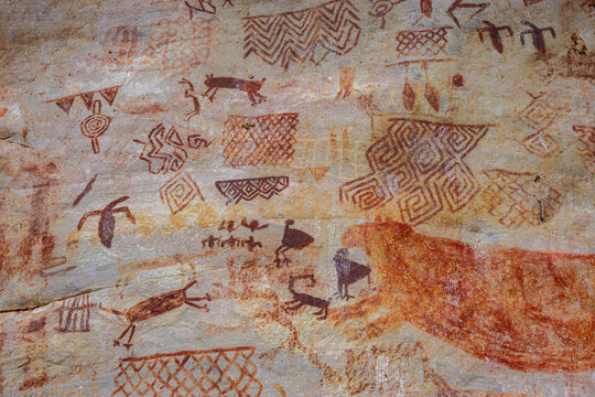 Ancient rock paintings in San Jose del Guaviare, Colombia, showcasing intricate designs and animal figures