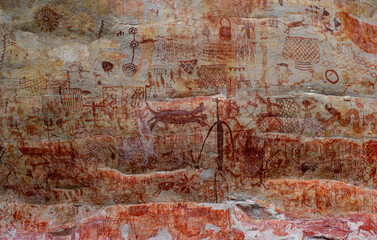 Ancient rock paintings in San Jose del Guaviare, Colombia, showcasing intricate designs and symbols