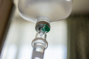 Close up medical intravenous IV drip in hospital background - 791831331