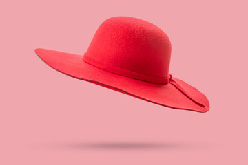 Woman red summer hat isolated on pink background