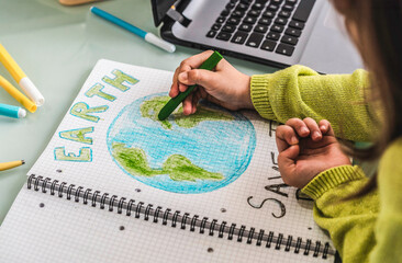 Young eco-warrior sketches a greener tomorrow. Educative art illustrates the urgency of Earth's preservation.