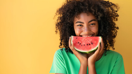 beautiful smiling black woman with curly hair in green tshirt holding watermelon slice covering her face - Powered by Adobe