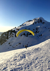 Paragliding on a snowy mountain