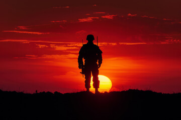 Minimalistic shot of a soldier's silhouette against a fiery sunset. 