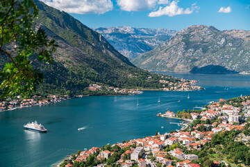 Bay of Kotor. Top view from Mount St. Ivan. Yachts and a cruise ship sail to the port.