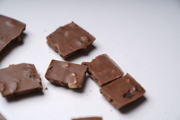 chocolate pieces on white background