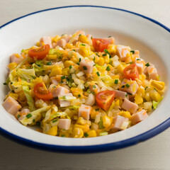 Turkey, corn, cabbage and mayonnaise salad. Traditional salad recipe for summer.