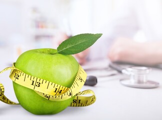 Healthy food. fresh apple at doctor dietician office
