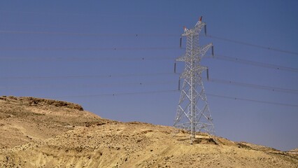 high voltage electric metal tower in the desert