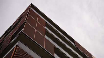 corner of residential building modern facade against the sky