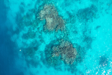 Drone top view of emerald reef in turquoise sea. Soothing ocean landscape. Sanma, Vanuatu. Tourism.