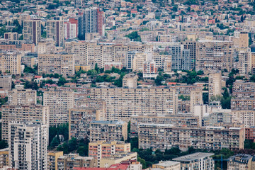 View on the soviet era buildings of Tbilisi from Mtatsminda hill in Georgia - obrazy, fototapety, plakaty