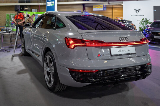 A new electric Audi Q8 e-tron premiere at a motor show, model 2024, rear view