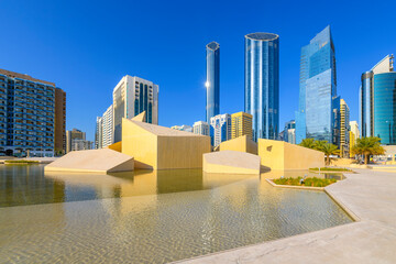 Waterfront cafes and modern architecture and design at the Cultural Foundation Park alongside the Qasr Al Hosn fort in the city center of Abu Dhabi, United Arab Emirates.