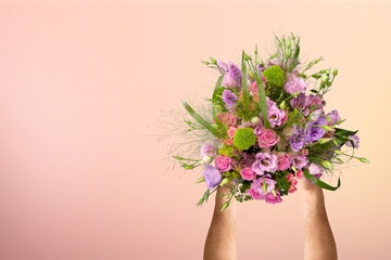 Female hands hold bouquet of beautiful fresh flowers