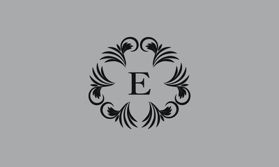 Elegant floral monogram design template for one or two letters such as E. Business sign, identity monogram for restaurant, boutique, hotel, heraldic, jewelry