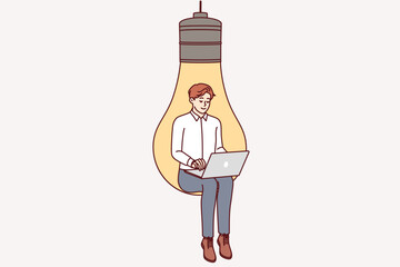 Man inventor with laptop sits in large light bulb, symbolizing inspiration for coming up with business ideas. Smart guy inventor develops web service or software for internet users